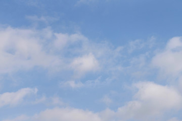 Blue sky with white fluffy clouds.