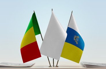 Flags of Mali and Canary Islands with a white flag in the middle