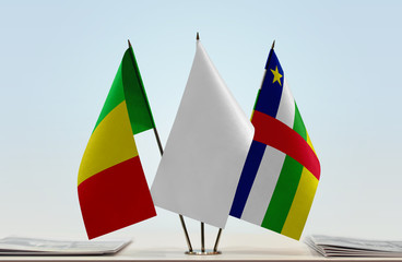 Flags of Mali and Central African Republic with a white flag in the middle