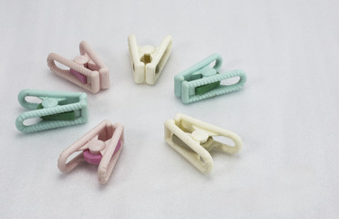 six clothes clasps green red cream conceptual leaving together