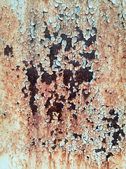 rust on metal surface covered with paint