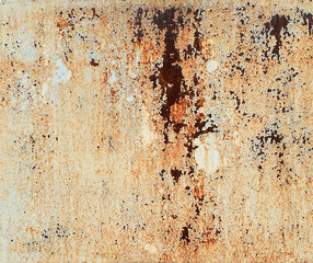 rust on metal surface covered with paint
