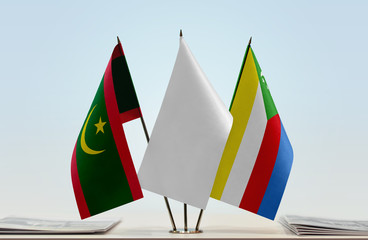 Flags of Mauritania and Comoros with a white flag in the middle