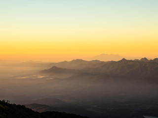 The sun rises on the top of the hill