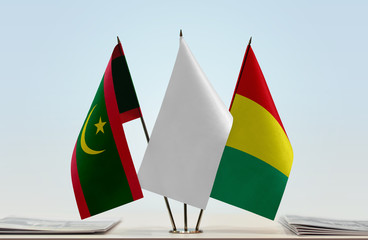 Flags of Mauritania and Guinea with a white flag in the middle