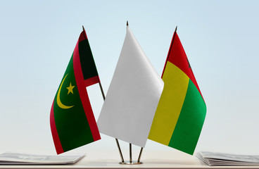 Flags of Mauritania and Guinea-Bissau with a white flag in the middle