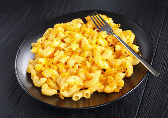 hot Mac and Cheese on black plate