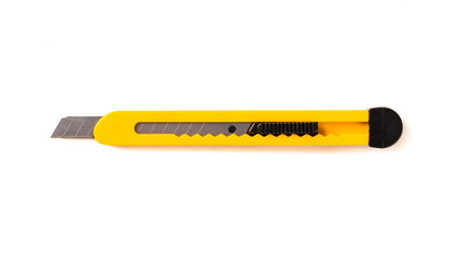 Yellow cutter knife isolated on white background.