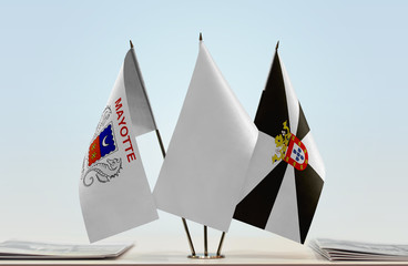 Flags of Mayotte and Ceuta with a white flag in the middle