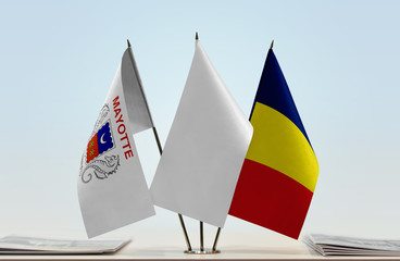 Flags of Mayotte and Chad with a white flag in the middle