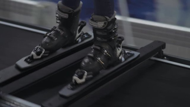 training apparatus, ski simulator, a girl trains on a ski simulator, girl trains 
