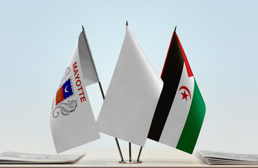 Flags of Mayotte and Sahrawi Arab Democratic Republic with a white flag in the middle