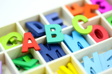 Close up  Colorful wooden English alphabe on white background.