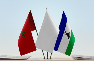 Flags of Morocco and Lesotho with a white flag in the middle