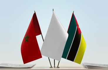 Flags of Morocco and Mozambique with a white flag in the middle