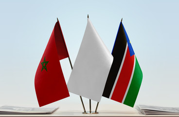 Flags of Morocco and South Sudan with a white flag in the middle