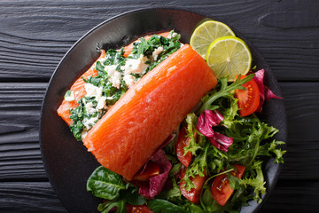 Delicious healthy food: salted salmon stuffed with spinach and cream cheese. horizontal top view