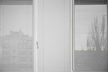 Window with white venetian blinds