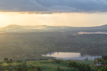 scene raining among a mountains during sunset