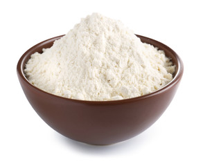Bowl with flour on white background