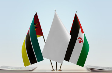 Flags of Mozambique and Sahrawi Arab Democratic Republic with a white flag in the middle