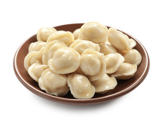 Plate with tasty dumplings on white background