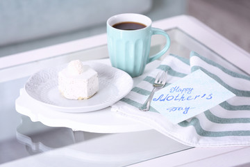 Tasty dessert, cup of coffee and card with words 