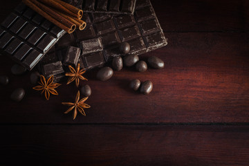 Chocolate, Cinnamon, Chocolate Balls on a Dark Wooden Background. Copy space. Flat lay, top view