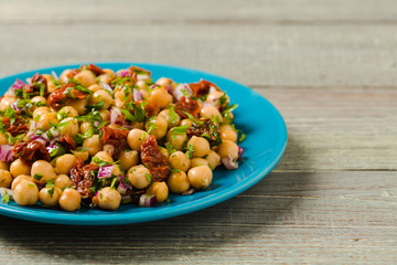 Chickpeas salad with onion and dried tomatoes.