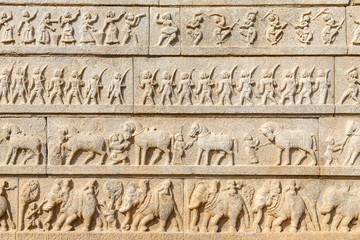 outer walls of the Hazara Rama temple show Hindu festive procession, Hampi, Karnataka, India