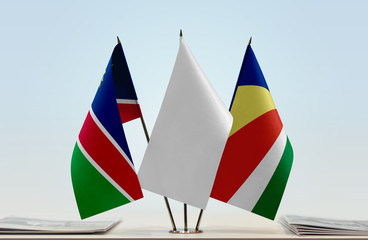 Flags of Namibia and Seychelles with a white flag in the middle