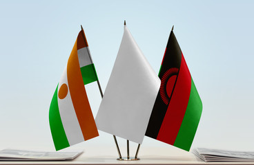 Flags of Niger and Malawi with a white flag in the middle
