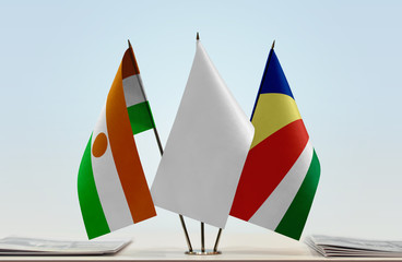 Flags of Niger and Seychelles with a white flag in the middle