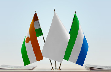 Flags of Niger and Sierra Leone with a white flag in the middle