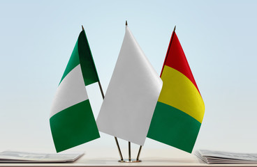 Flags of Nigeria and Guinea with a white flag in the middle