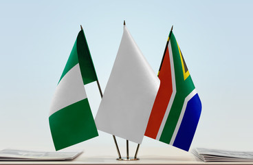 Flags of Nigeria and Republic of South Africa with a white flag in the middle