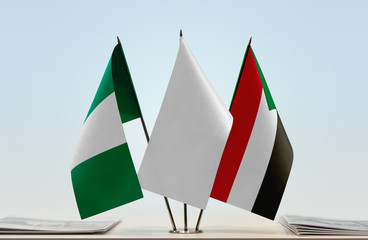 Flags of Nigeria and Sudan with a white flag in the middle