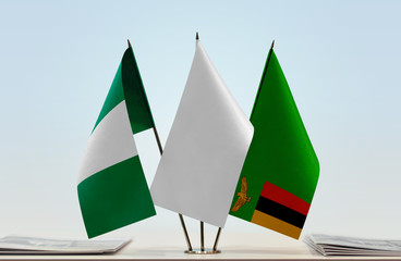 Flags of Nigeria and Zambia with a white flag in the middle