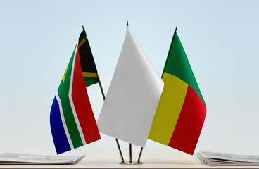 Flags of Republic of South Africa and Benin with a white flag in the middle