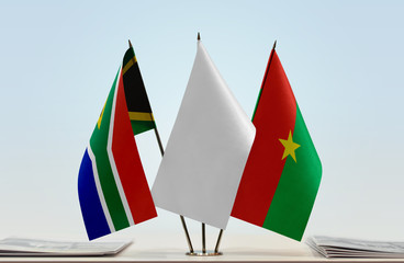 Flags of Republic of South Africa and Burkina Faso with a white flag in the middle