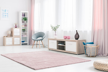 Spacious pink living room interior - obrazy, fototapety, plakaty