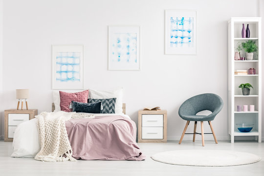 Pastel bedroom interior with armchair