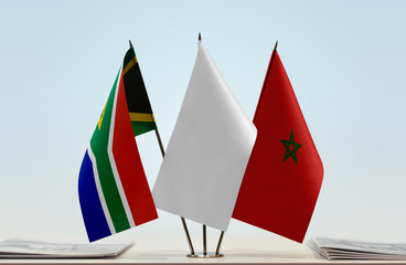 Flags of Republic of South Africa and Morocco with a white flag in the middle