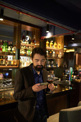 Young man checking phone