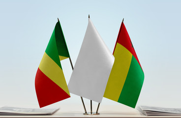 Flags of Republic of the Congo and Guinea-Bissau with a white flag in the middle