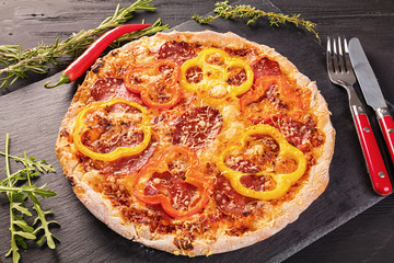 Delicious pizza served on ceramic plate 