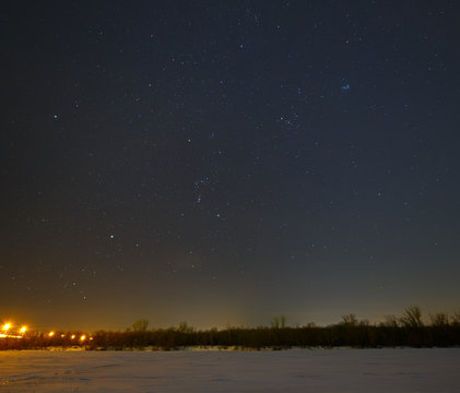 Stars in the night sky over the frozen river Don in Russia.