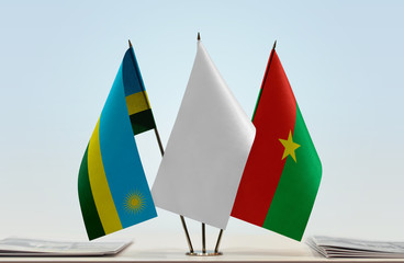 Flags of Rwanda and Burkina Faso with a white flag in the middle