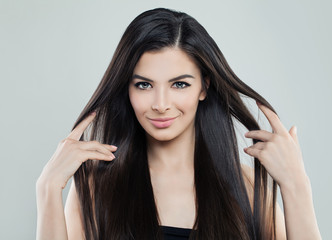 Naklejka premium Pretty Young Model Woman with Long Silky Hair and Natural Makeup, Hair care Concept