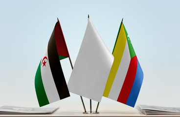 Flags of Sahrawi Arab Democratic Republic and Comoros with a white flag in the middle